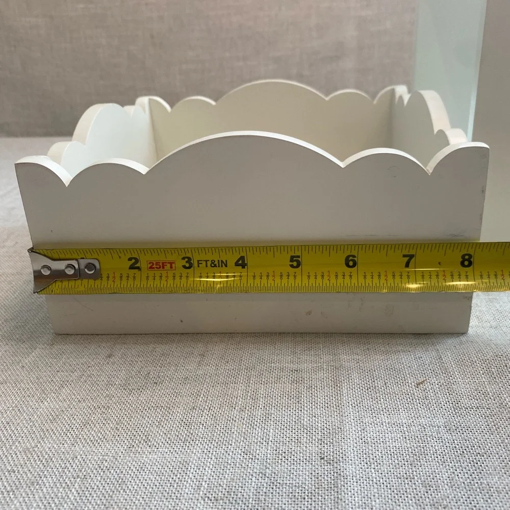 Two wall hanging white shadow boxes.